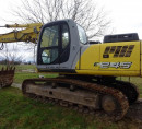 Bager goseničar New Holland E 245, letnik 2007